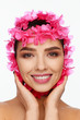 © Andriy Goncharenko - Portrait of an energetic laughing beautiful woman with a pink wreath on her head