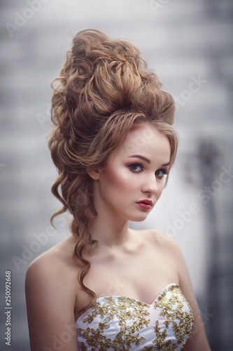 Beautiful Woman In An Ancient Medieval Dress With A High Complex