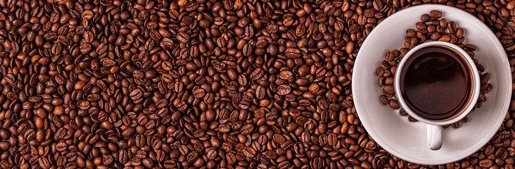 Cup of coffee on a background of coffee beans