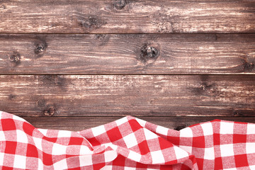 Wall Mural - Red napkin on brown wooden table