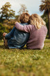 © Jacob Lund - Small brother and sister sitting at park
