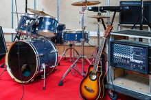 Modern Music Instruments And Equipments For Rock Band In Empty Rehearsal Room