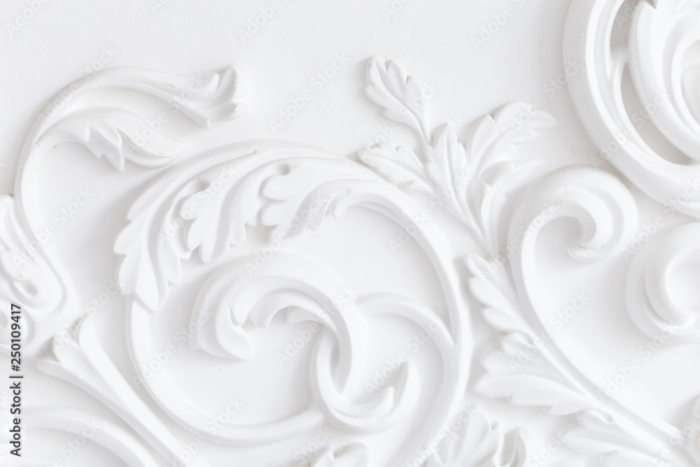Beautiful ornate white decorative plaster moldings in studio - obrazy, fototapety, plakaty 