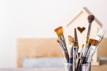 Art Brush Set and wooden house for decoration, selective focus