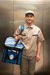 © View Stock - Male Courier with a parcel