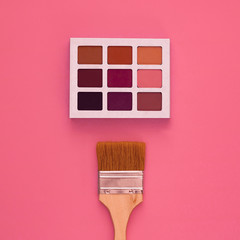 Wall Mural - Palette of cosmetic shadows on a graphic background with lines, purple and pink shades, close-up, day, top view. Concept - exaggeration in makeup