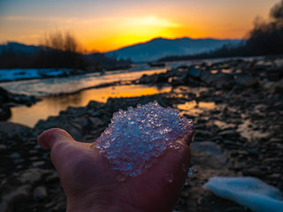 Beautiful landscape stones in mountain lake, reflection, blue sky and yellow sunlight in sunrise. Ukraine. Amazing scene