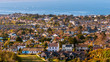Sunset over the beautiful Dalkey village viewed from the Killiney Hill Park top on a spring evening. Cityscape of Dublin city architecture, Ireland.