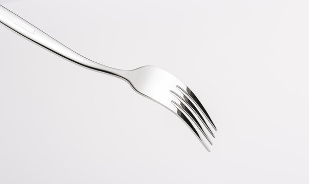 Fototapete - A fork on white background