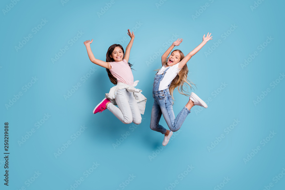 Full length body size view of two people nice-looking crazy lovely attractive cheerful carefree straight-haired pre-teen girls having fun great weekend time overjoy isolated over blue pastel - obrazy, fototapety, plakaty 