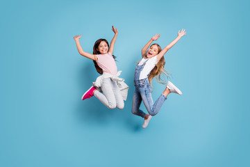 Poster - Full length body size view of two people nice-looking crazy lovely attractive cheerful carefree straight-haired pre-teen girls having fun great weekend time overjoy isolated over blue pastel