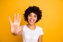 Close Up Photo Beautiful Amazed She Her Dark Skin Lady Glad Arms Hands Five Fingers Raised Show Countable Uncountable Things Lesson Wearing Casual White T-shirt Isolated Yellow Bright Background