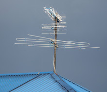 TV Antenna On The Roof Of The House