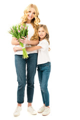 Wall Mural - cute daughter hugging mom holding bouquet of beautiful tulips isolated on white