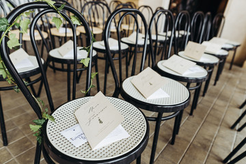 Wall Mural - Name cards lie on the chairs ready for wedding ceremony