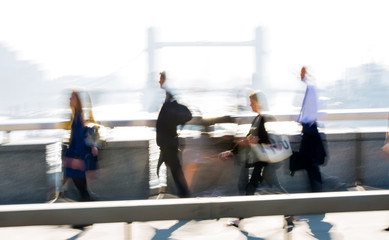 Poster - Blur of people walking over the London bridge on the way to work in the City of London. Early morning commuters. 