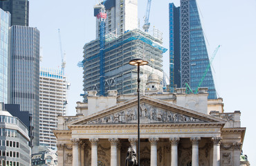  Stock exchange building in the City of London. New skyscrapers at the background. City of London browning fast.