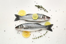 Tasty Fresh Seabass Fish With Spices On White Background
