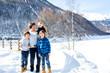 © Tomsickova - Family, enjoying winter view of snowy mountains and frozen lake