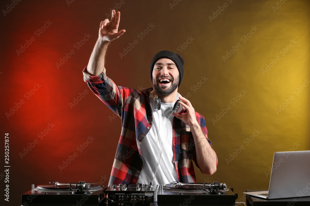 Male DJ playing music in club