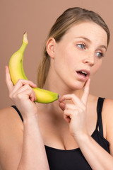 Wall Mural - cute girl with a banana