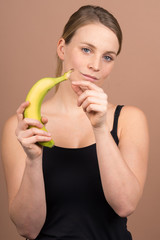 Wall Mural - cute girl with a banana