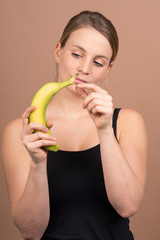 Wall Mural - cute girl with a banana