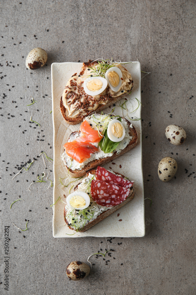 Plate with fresh tasty bruschettas on table