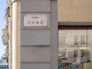 Corso Como street plate on the wall. Milan, Italy.