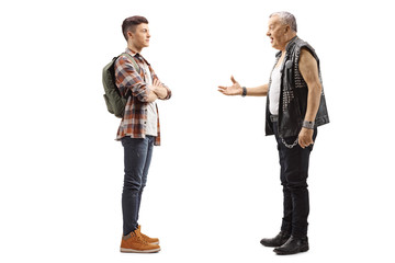 Wall Mural - Elderly male punker talking to a young teenage male student