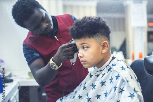 Boy In The African Barbershop Cute Mixed Boy Makes A