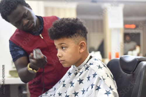 Boy In The African Barbershop Cute Mixed Boy Makes A