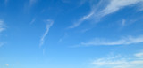 Fototapeta Na sufit - Light clouds in blue sky. Wide photo.