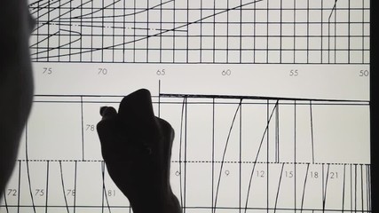 Wall Mural - young architect using creative pen display tablet in the work at night. drawings on the interactive 