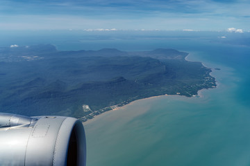 Wall Mural - Flying over Phu Quoc island, Vietnam. Tropical beach ocean landscape. View from airplane window