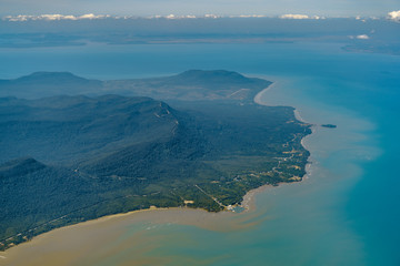 Wall Mural - Flying over Phu Quoc island, Vietnam. Tropical beach ocean landscape. View from airplane window