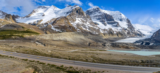 Wall Mural - Mt. Athabasca and Mt Andromeda - A panoramic Spring view of massive snow-covered Mt. Athabasca and Mt. Andromeda rising high at side of Athabasca Glacier, Jasper National Park, Alberta, Canada.