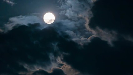 Wall Mural - Time lapse of super moon with cloudy night sky and shiny stars background.