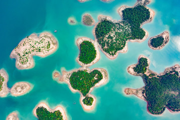 (View from above) Stunning aerial view of a heart-shaped island in the middle of a group of other islands in Nam Ngum Reservoir in Thalat located in northern Laos.