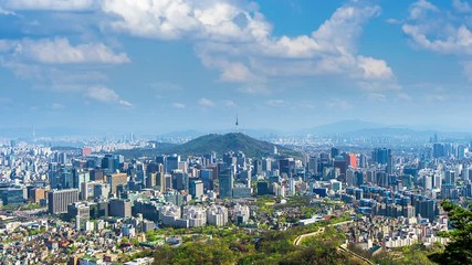 Fototapete - Time lapse of Cityscape in Seoul with Seoul tower and blue sky, South Korea.