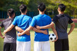 © imtmphoto - rear view of four asian soccer players