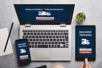 Wall Mural - delivery tracking concept on laptop, tablet and smartphone screen