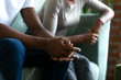 © fizkes - Black married couple spouses quarrelled close up male hands