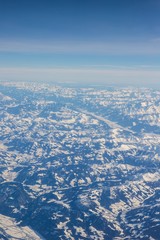 Wall Mural - Aerial view of snow covered mountains - snowy mountain peaks - high mountains - Alps