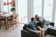 © Yakobchuk Olena - Happy family spending time together at their modern cozy house