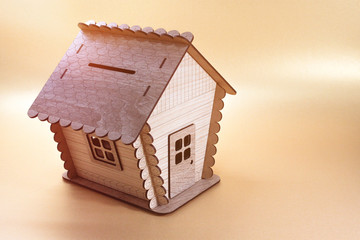 Toy wooden house.The constructor carved from plywood for children. Wooden house model