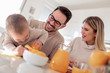 © ivanko80 - Family make fresh orange juice