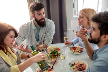 Canvas Print - Friends having lunch together at home