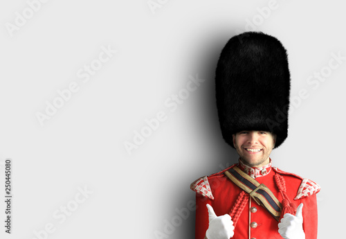 Young man in the costume of the Royal guards of Britain Poster Mural XXL