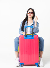 Traveler tourist woman in summer casual clothes.Asian Smiling woman wearing sun glasses.Passenger traveling abroad to travel on white background.